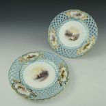 A pair of Minton reticulated scene painted plates