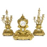 A 19th Century French gilt ormolu clock garniture, circa 1870, of Baroque design incorporating a