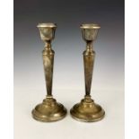 A large pair of Elizabeth II silver candlesticks, A T Cannon, Birmingham 1974