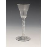 An airtwist wine glass, circa 1755, the pan topped bowl on a multi strand open spiral stem,