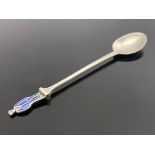 Liberty and Co., an enamelled silver figural tea spoon, Birmingham 1915