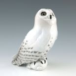 A Royal Copenhagen model of a snowy owl with rabbit, 23cm high