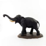 A Japanese bronze elephant by Genruysai Seiya, Meiji period, 1868-1912, modelled strolling with