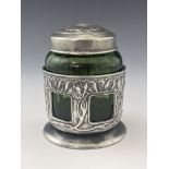 Rex Silver for Liberty and Co., a Tudric Arts and Crafts pewter and green glass tea caddy