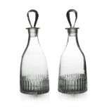 A pair of Anglo Irish glass spirit decanters, circa 1775, tapered form with moulded fluting and