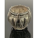 An Indian white metal pot, circa 1910, repousse embossed and chased lobed form with foliate scroll