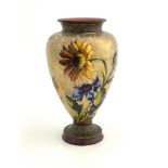 A Doulton Lambeth faience lustre vase, footed inverse baluster form, painted with daisies and