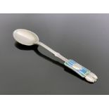 Archibald Knox for Liberty and Co., an Arts and Crafts silver and enamelled Medea teaspoon,