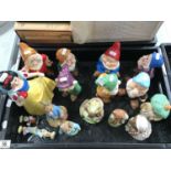 A collection of Disney Snow White and Seven Dwarves figures, together with Royal Albert Beatrix