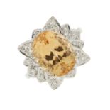 An 18ct gold orange topaz and brilliant-cut diamond cocktail ring, with slightly tapered