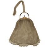 An early 20th century 14ct gold mesh purse or evening bag, with black enamel scrolling surmount,