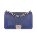 Chanel, a medium blue python Boy handbag, designed with a blue python skin exterior and smooth