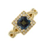An 18ct gold blue topaz and brilliant-cut diamond cluster dress ring, with similarly-cut diamond
