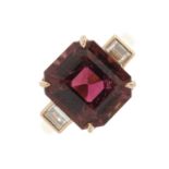 An 18ct gold purple tourmaline and diamond three-stone ring, tourmaline estimated weight 5ct,