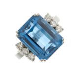 An 18ct gold blue topaz single-stone dress ring, with brilliant-cut diamond line sides and