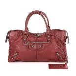 Balenciaga, a Giant 12 Part-Time handbag, crafted from crinkled plum leather, featuring textured