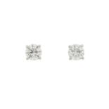 An impressive pair of 18ct gold brilliant-cut diamond single-stone stud earrings, total diamond