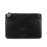 Alaia, a smooth black leather pouch, featuring the maker's embossed logo to the lower centre