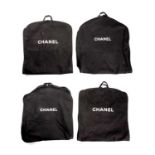 Chanel, four garment bags, crafted from back canvas with the maker's white branding to the front,