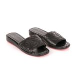 Chanel, a pair of Ligne Cambon slide sandals, featuring black quilted leather uppers with applied CC