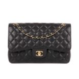 Chanel, a Jumbo Classic Double Flap handbag, featuring the maker's signature black quilted caviar