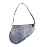 Christian Dior, a small Saddle handbag, featuring a two-tone printed denim design to the canvas