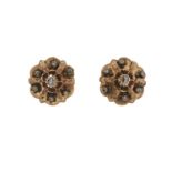 A pair of early 20th century gold, rose-cut diamond cluster earrings, with with engraved spacers and