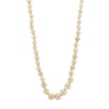 An early 20th century graduated pearl necklace, with pave-set diamond push-piece barrel clasp,