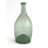 A small green glass bottle, 18th century, shouldered mallet form, with folded rim, high domed
