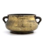A Chinese bronze censer, Xuande cast mark, twin handled squat baluster form, 19cm long