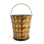 A parquetry peat bucket, ribbed design, alternating vertical staves tapering to foot, brass liner