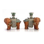 A pair of 19th Century Canton famille rose standing elephant candle holders, looking to the right