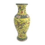 A Chinese famille jaune vase, inverse baluster form, painted with dragons in flight amongst peonies,