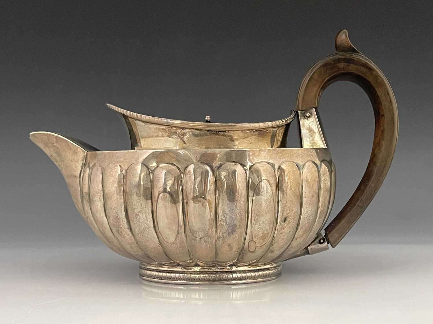 A George III silver teapot, Peter, Ann and William Bateman, London 1802, hemispherical shouldered