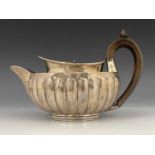 A George III silver teapot, Peter, Ann and William Bateman, London 1802, hemispherical shouldered