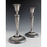 A pair of Elizabeth II silver candlesticks, C J Vander, Sheffield 1990, Neoclassical reeded