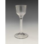 An opaque twist wine glass, circa 1760, the ogee bowl on a double spiral and central multi strand