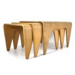 After Marcel Breuer, a nest of three laminated beech plywood occasional tables, originally