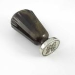 A hardstone and white metal seal, carved conical handle, 8cm high