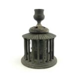 A 19th century Italian Grand Tour bronze candlestick holder, modelled as the Roman Temple of