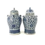 A lage pair of Chinese blue and white temple jars and covers, inverse baluster form, painted with
