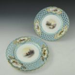 A pair of Minton reticulated scene painted plates, each with a central view of Venice and a European