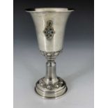 An Israeli silver and gem set kiddush cup, pedestal form with trumpet bowl and splayed foot, applied