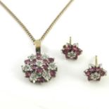 Ruby and diamond cluster pendant and matching stud earrings, flower form pendant set with seven