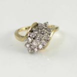 a 14kt gold diamond cluster ring