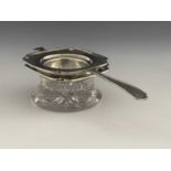 An American sterling silver tea strainer and stand, Frank Whiting, circa 1905, the square rimmed