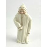 A Royal Worcester candle snuffer, Toddie, 1897, modelled as a boy in oversized night gown, puce