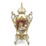 A Coalport relief moulded and jewelled portrait painted bracket vase, bombe form on reticulated