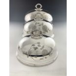 A suite of three graduated electroplate meat dish covers, comprising one large and two smaller sized