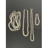 A three strand cultured pearl necklace with 14K gold metal clasp, total length 60cm, a similar